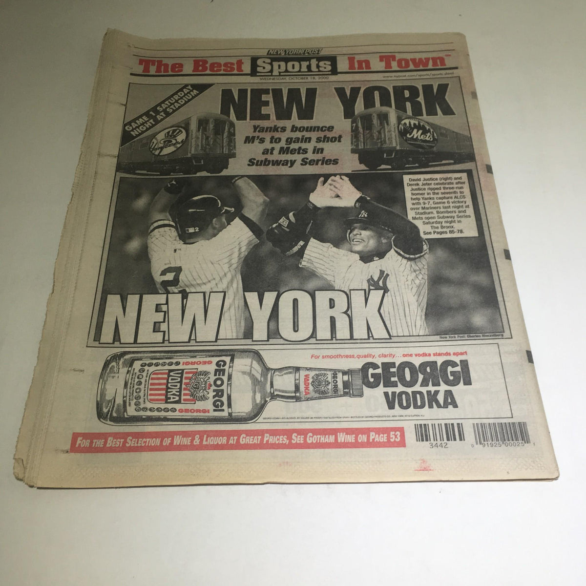 Back side of the New York Post detailing sports news with a promotion for Georgi Vodka, dated October 2000.