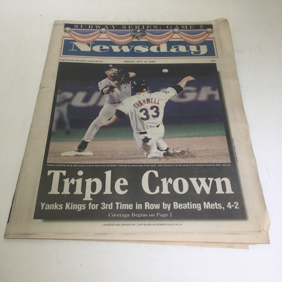 Cover of Newsday from October 27, 2000, featuring the headline 'Triple Crown' about the Subway Series Game 5, highlighting Yankees winning against Mets.