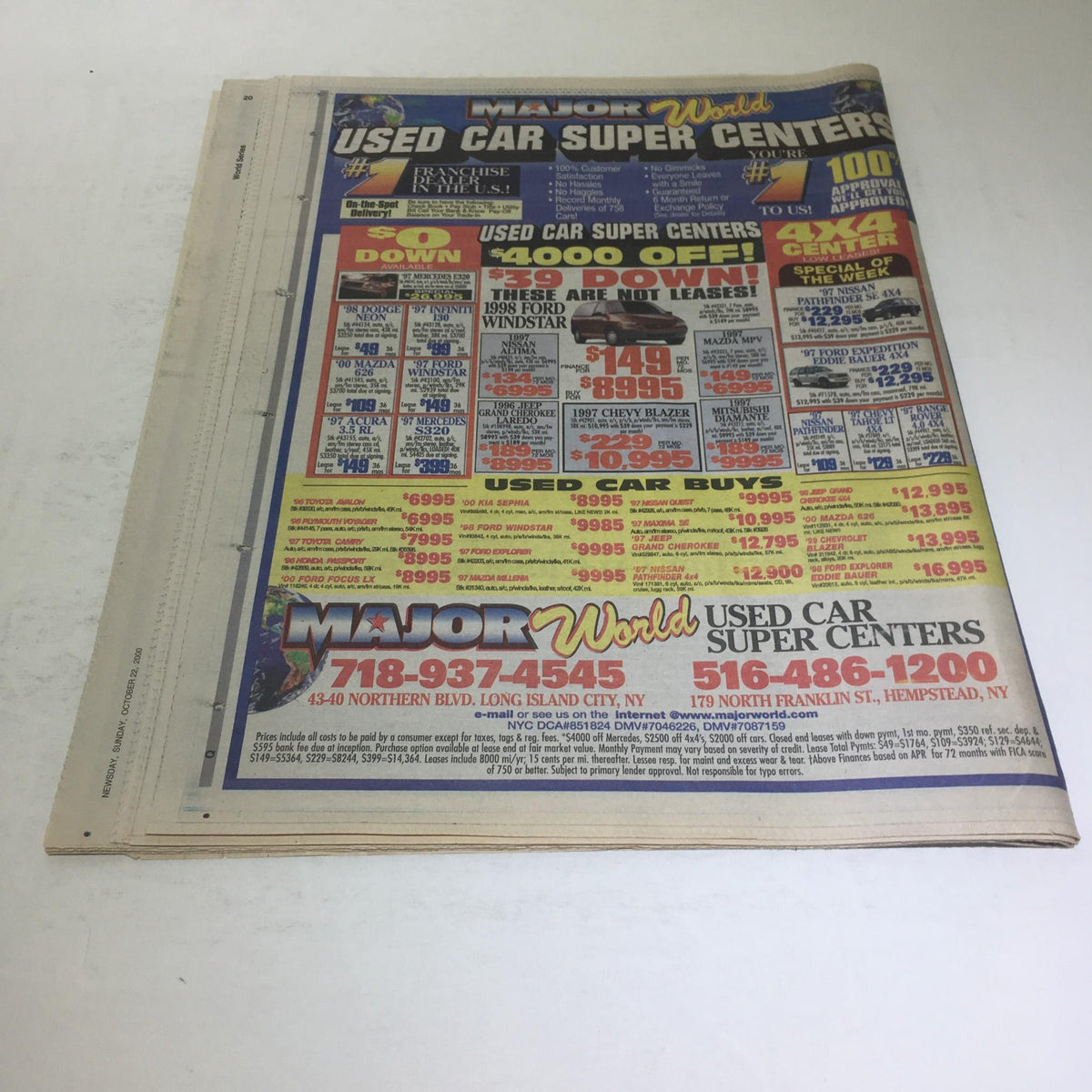 Back page of the Newsday newspaper from October 22, 2000, displaying an advertisement for Major World Used Car Super Center.