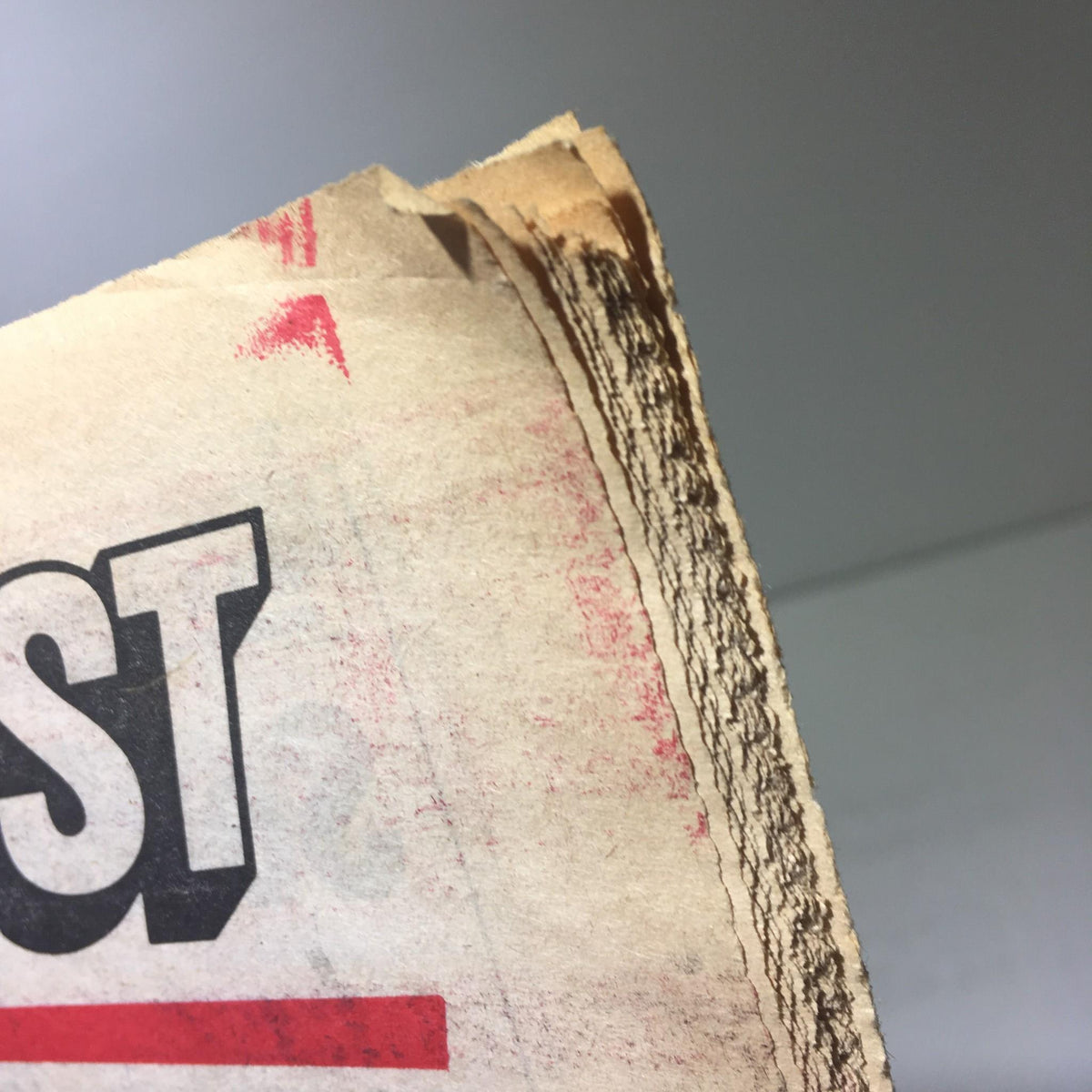 Side view of the New York Post newspaper, illustrating its vintage condition and historic value, featuring the headline 'Giants Win By A Whisker Super!'.