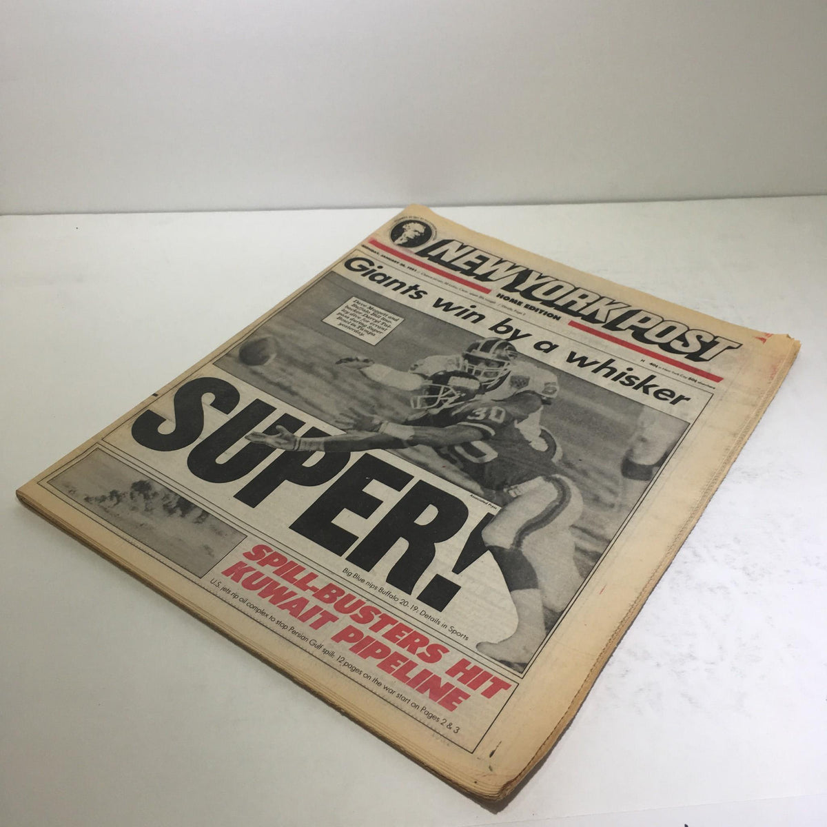 New York Post newspaper from January 28, 1991, featuring the headline 'Giants Win By A Whisker Super!' showcasing a vintage sports journalism moment.