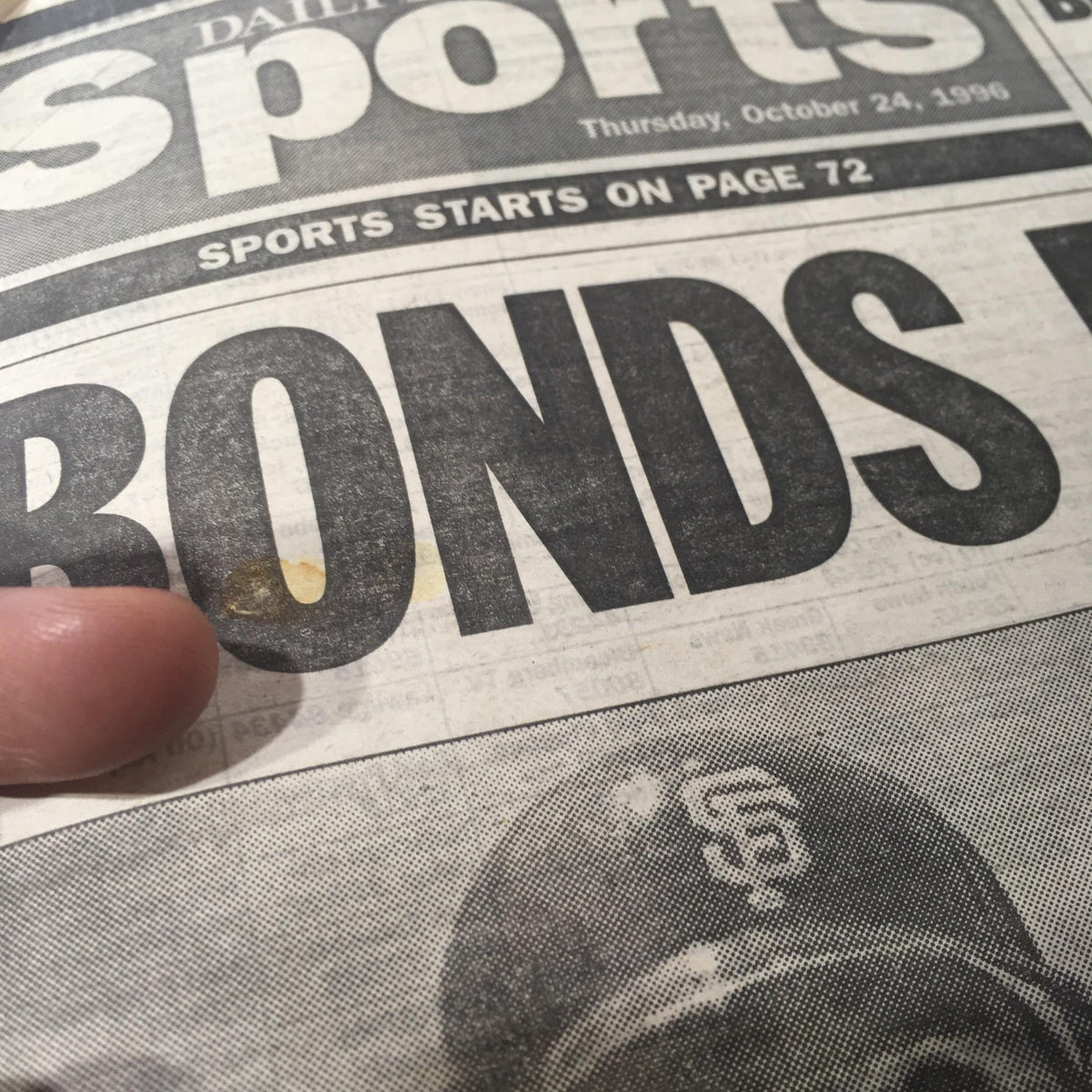Detail shot of the New York Daily News sports section from October 24, 1996, focusing on the headline 'BONDS' along with a section showing discussion of the baseball market.