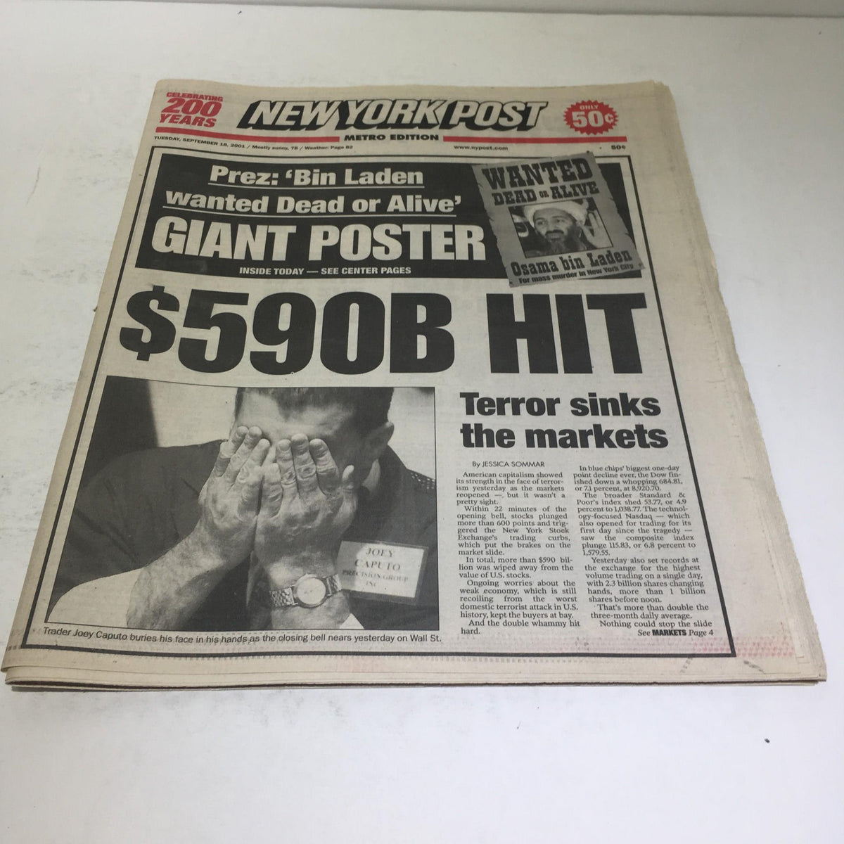 Cover of the New York Post, titled 'New York Post: Sept 28 2001 $590 Hit Terror Sinks The Markets,' featuring a distressed man with hands on his face over a headline about market collapse.