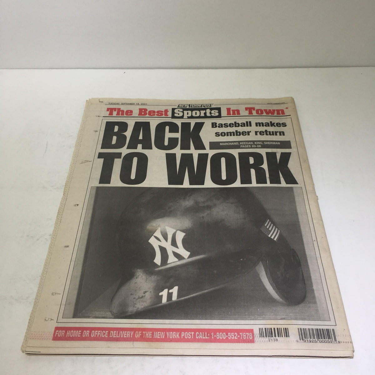 The front page of the New York Post, titled 'New York Post: Sept 28 2001 $590 Hit Terror Sinks The Markets,' showcasing a New York Yankees helmet with the words 'BACK TO WORK.'