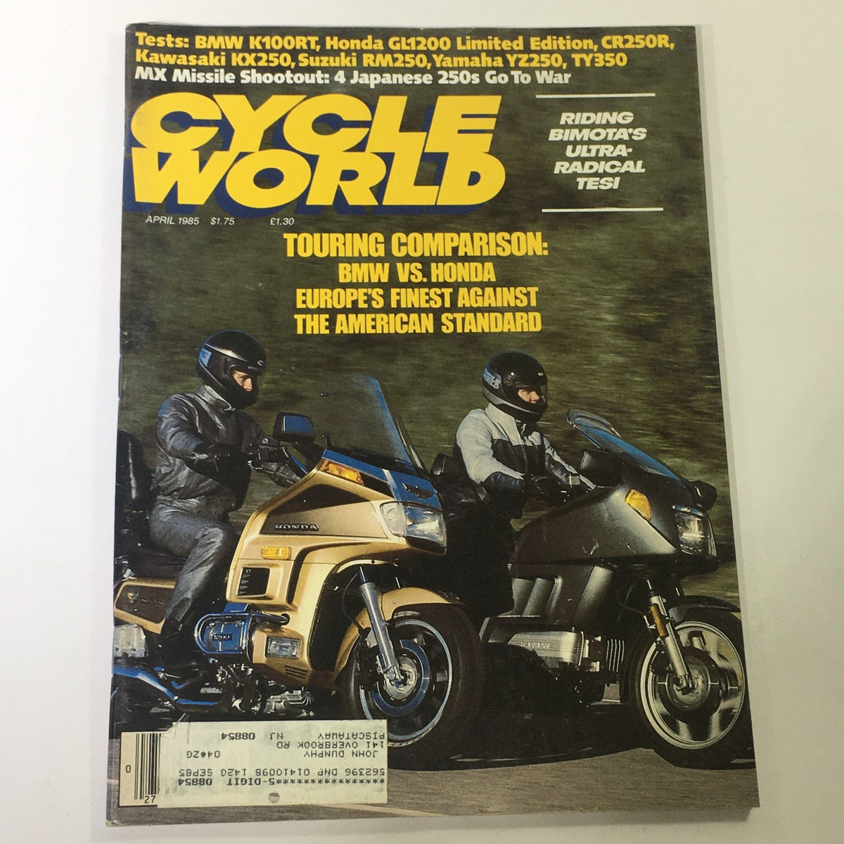 Vintage Cycle World Magazine from April 1985 featuring BMW K100RT and Honda GL1200 Limited Edition on the cover. The magazine highlights a touring comparison between these iconic motorcycles, showcasing their design and performance.