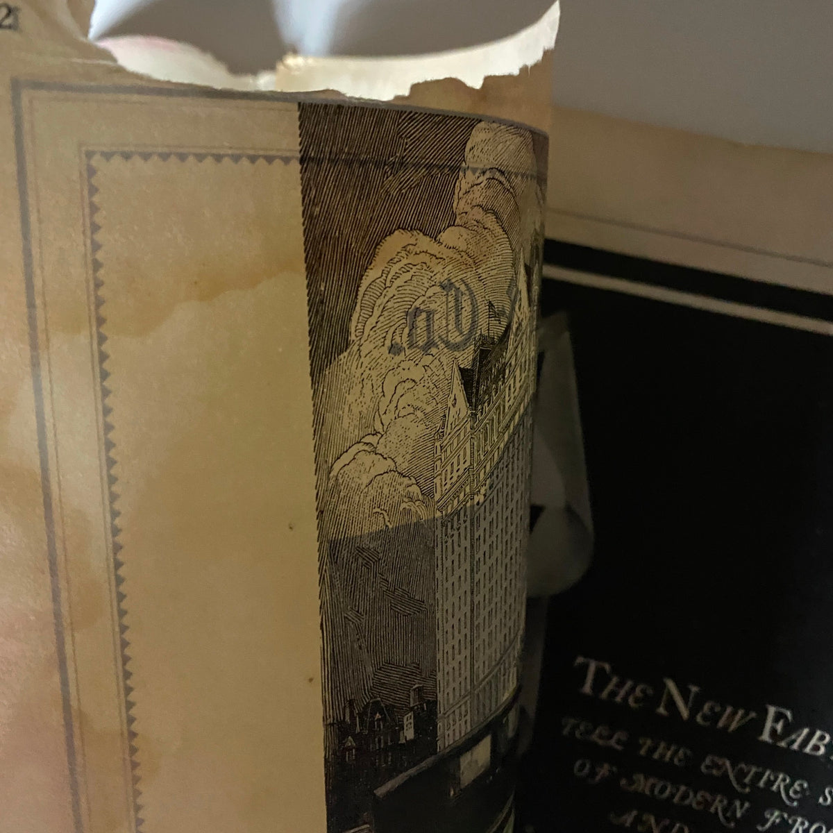 Partially torn inner page of The New Yorker Complete Magazine November 13, 1926, exposing vintage illustrations and advertisements.