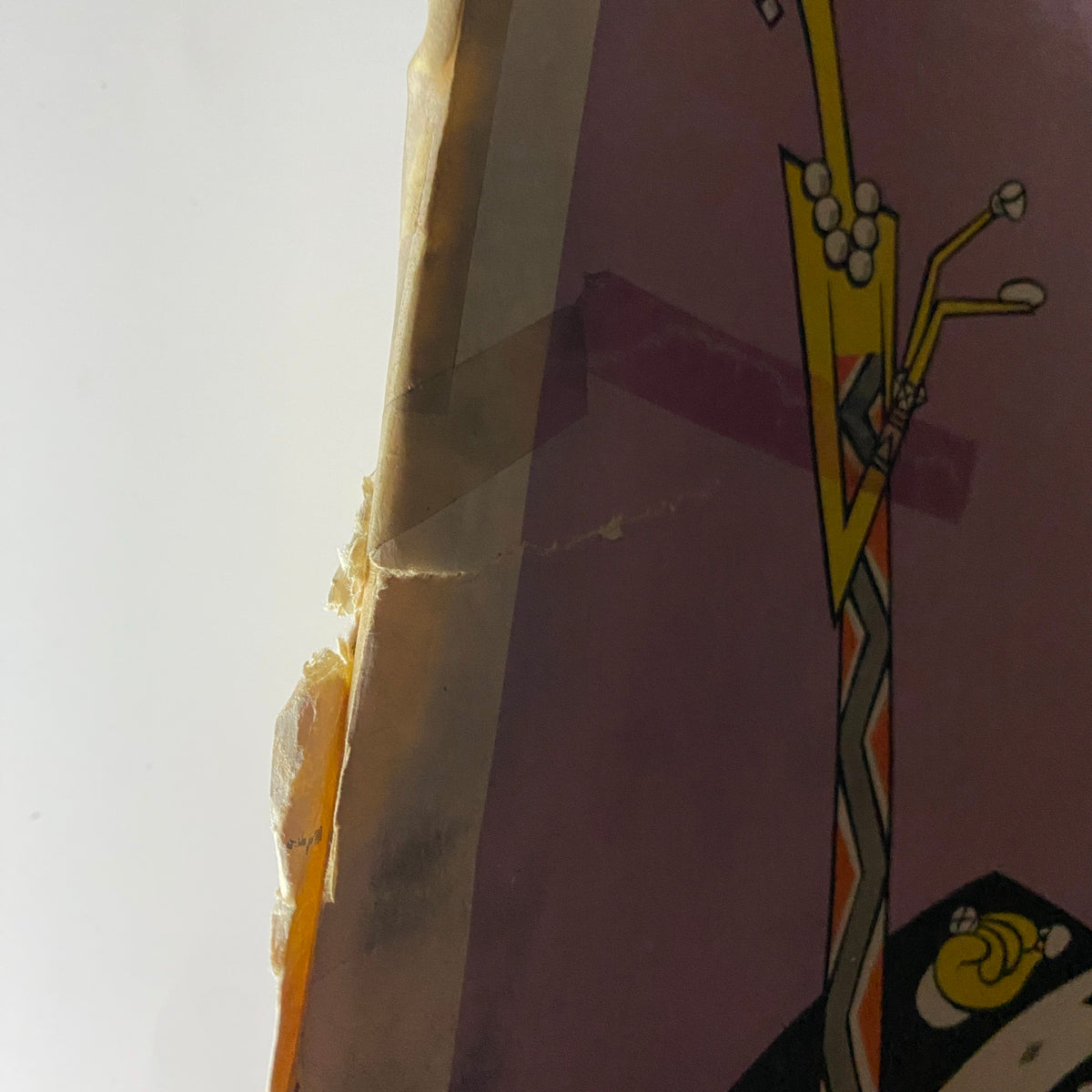 Side view of The New Yorker Complete Magazine November 13, 1926, showing age-related wear and a tear along the spine.