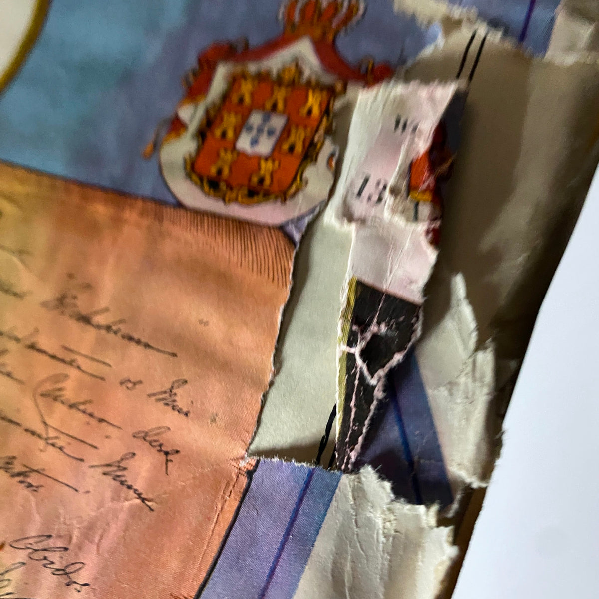 Close-up of a damaged corner from The New Yorker Complete Magazine November 13, 1926, highlighting wear and tear with a glimpse of printed text.