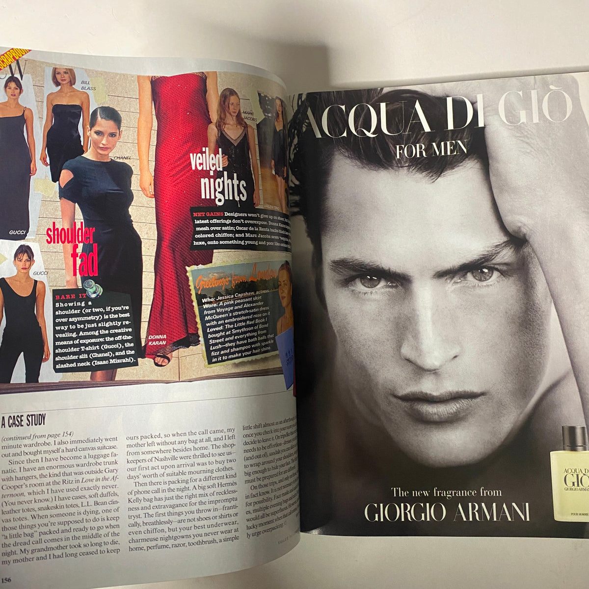 Page spread from Vogue Magazine November 1997 showcasing fashion trends and advertisements, including a fragrance advertisement for Acqua di Gio by Giorgio Armani.