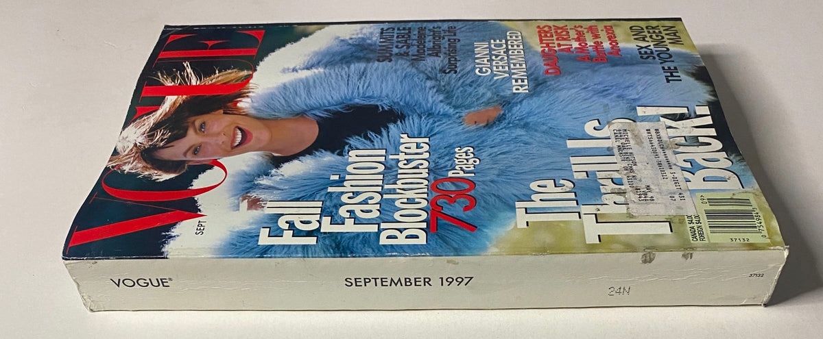 Vogue Magazine September 1997 cover side view, showcasing Linda Evangelista in a blue outerwear, celebrating fashion and culture with bold headlines and vibrant colors.