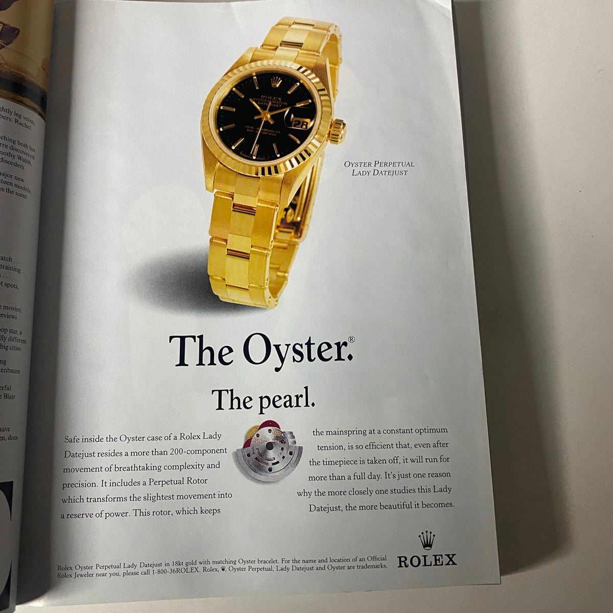 Rolex Oyster Perpetual Lady Datejust advertisement from Vogue Magazine September 1997 featuring a luxurious gold watch with a black dial. The image showcases the elegance and craftsmanship of the Rolex brand.