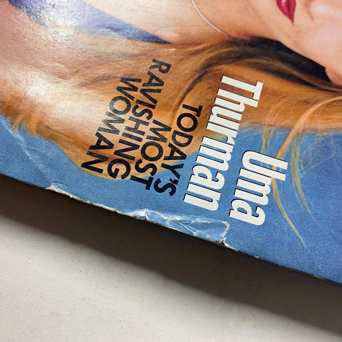 Close-up view of Vogue Magazine June 1997 cover text highlighting Uma Thurman as 'Today's Most Ravishing Woman'.