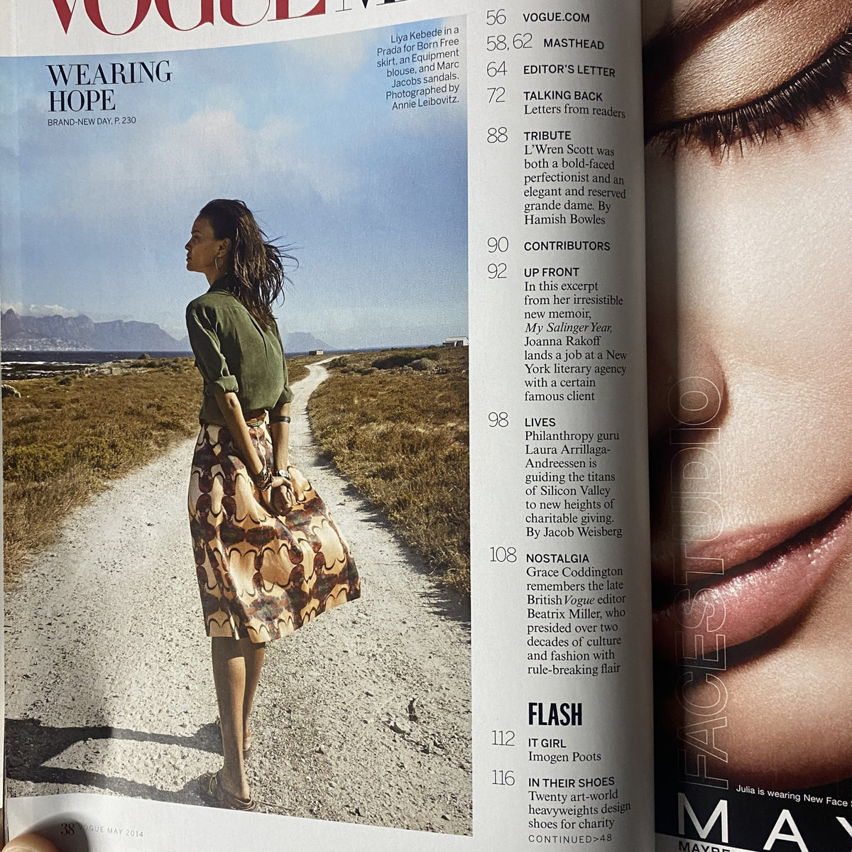 Interior page of Vogue Magazine May 2014, highlighting the article 'Wearing Hope' accompanied by a fashionable model in a scenic outdoor setting.
