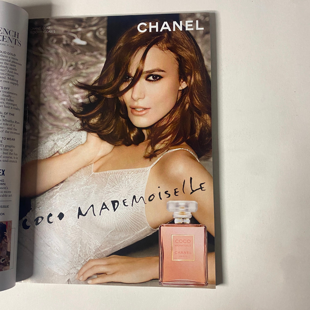 Vogue Magazine May 2014 cover featuring Coco Mademoiselle fragrance advertisement, showcasing a model with luxurious hair and fashion.