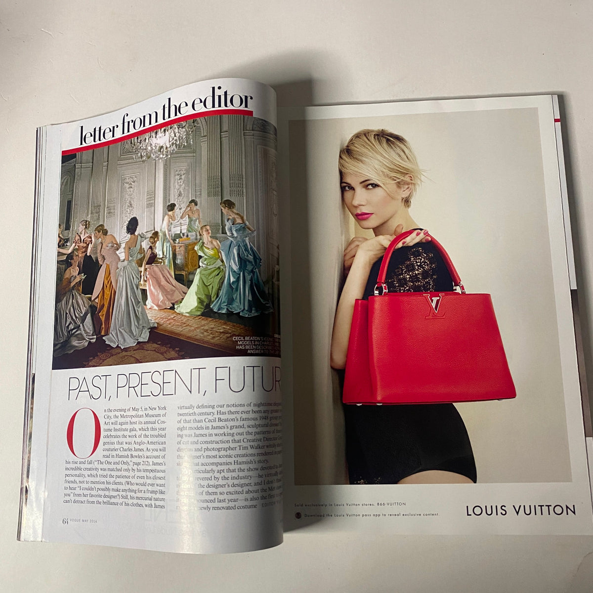 Vogue Magazine May 2014, showcasing a letter from the editor and Louis Vuitton fashion advertisement featuring a blonde model with a red handbag.