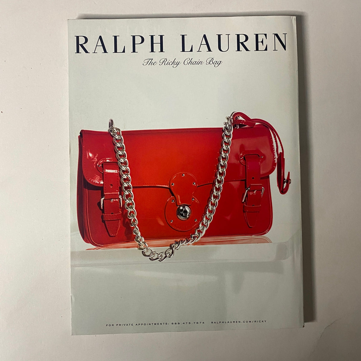 Vogue Magazine May 2014, featuring a Ralph Lauren advertisement for the Ricky Chain Bag in vibrant red.