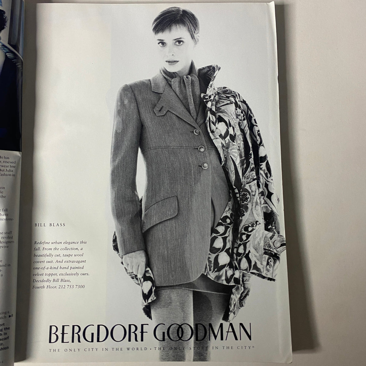 Vogue Magazine August 1994 featuring a black and white fashion advertisement for Bergdorf Goodman, showcasing a model in a tailored suit by Bill Blass, highlighting 1990s style trends.