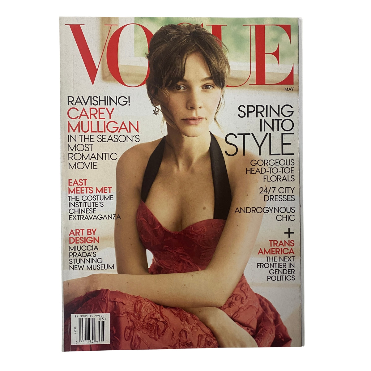 Cover of Vogue Magazine May 2015 featuring Carey Mulligan, showcasing her elegant look in a red dress with the headline 'Spring Into Style' highlighting gorgeous florals and androgynous chic fashion trends.