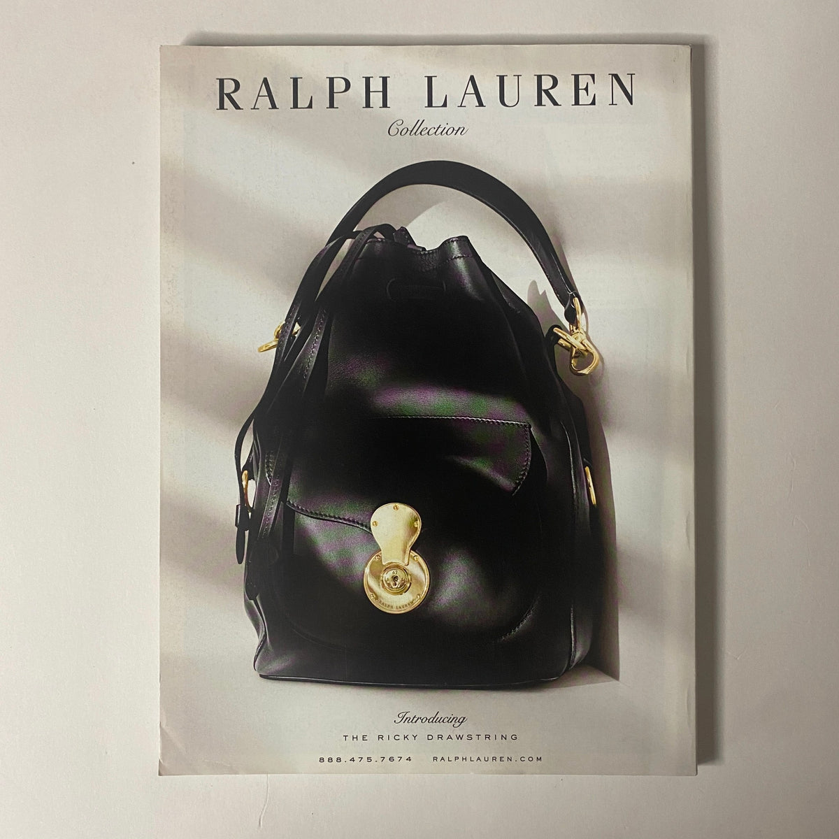Ad page from Vogue Magazine May 2015, displaying a luxurious Ralph Lauren handbag, emphasizing high-end fashion accessories.