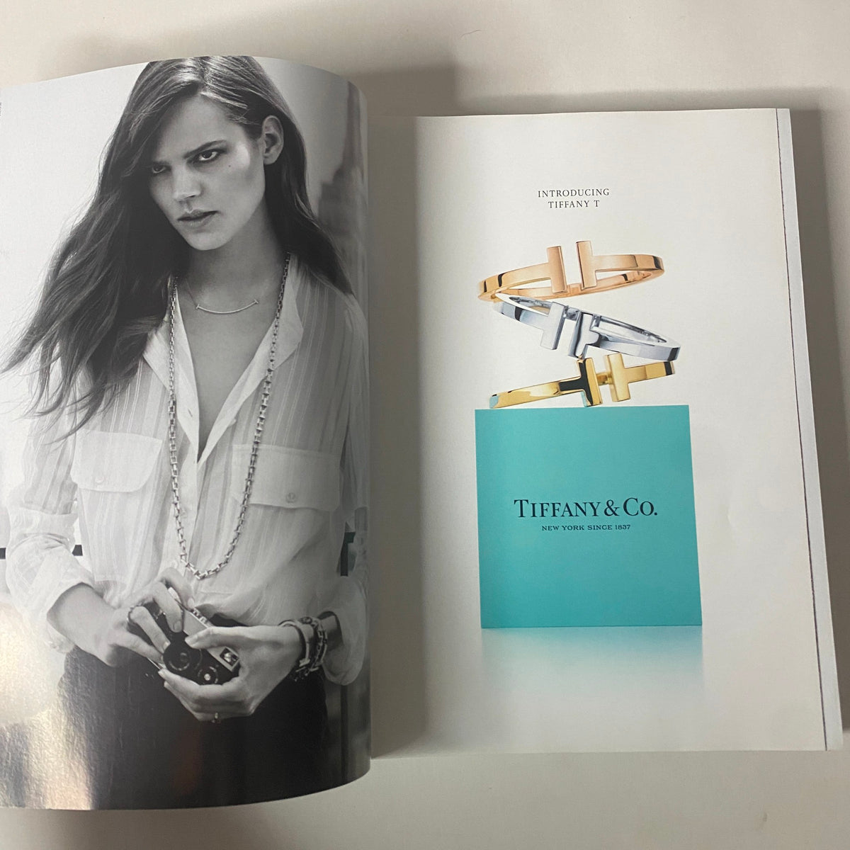 Inside advertisement from Vogue Magazine September 2014 introducing Tiffany & Co.'s new jewelry collection, featuring a model and elegant design.