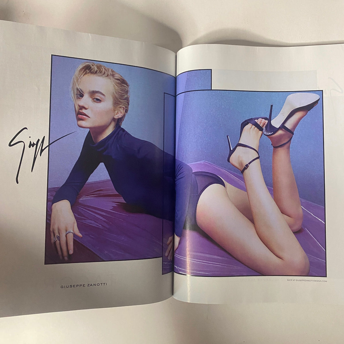 Vogue Magazine March 2017 displays an advertisement for Giuseppe Zanotti featuring a model posing elegantly with stylish shoes, promoting high fashion trends in footwear.