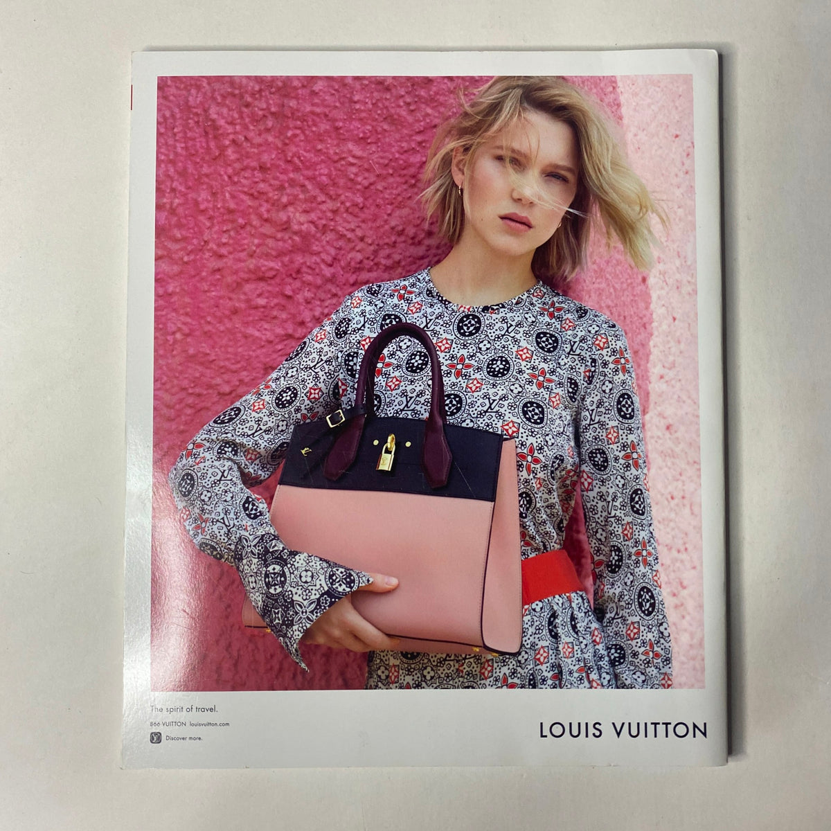 Fashion advertisement page from Vogue Magazine 2016 featuring a model with a Louis Vuitton handbag, emphasizing luxury fashion in the context of Met Gala celebrations.