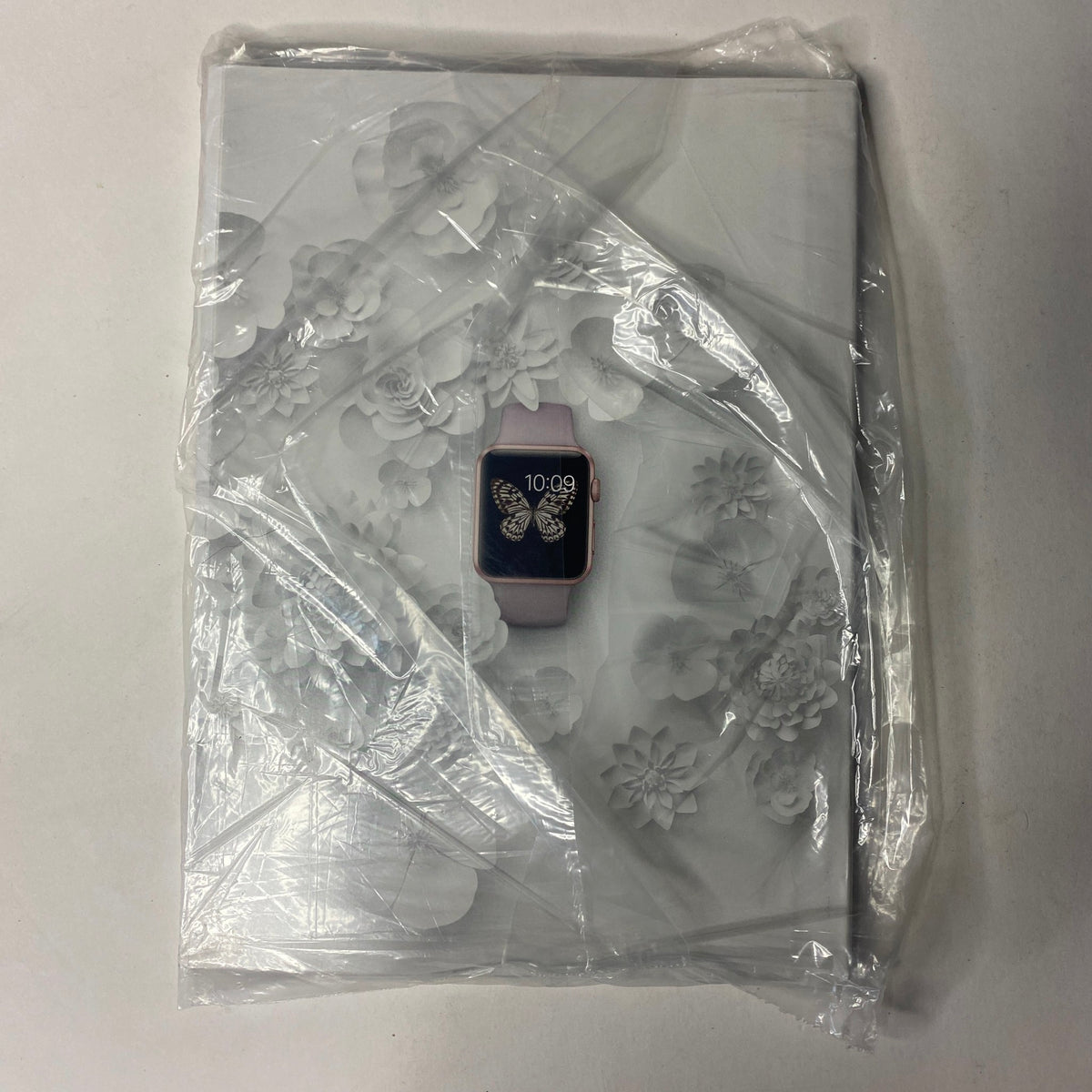 Back cover of Vogue Magazine April 2016, showcasing intricate floral designs with a smartwatch displayed, brand new and sealed.