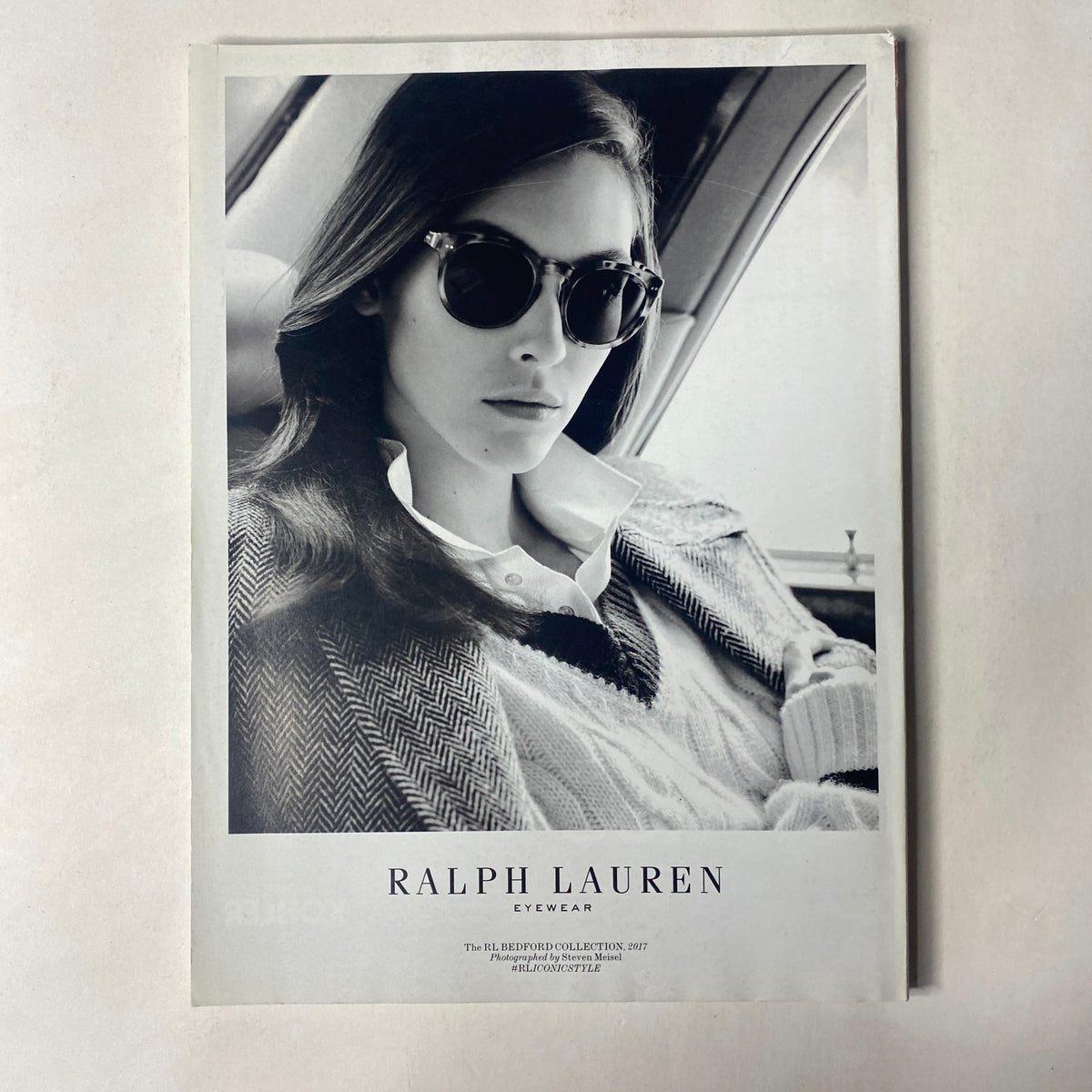 Vogue Magazine May 2017 Katy Perry Cover No Label VG displaying a black and white advertisement for Ralph Lauren eyewear, featuring a model wearing stylish sunglasses and a sophisticated outfit.