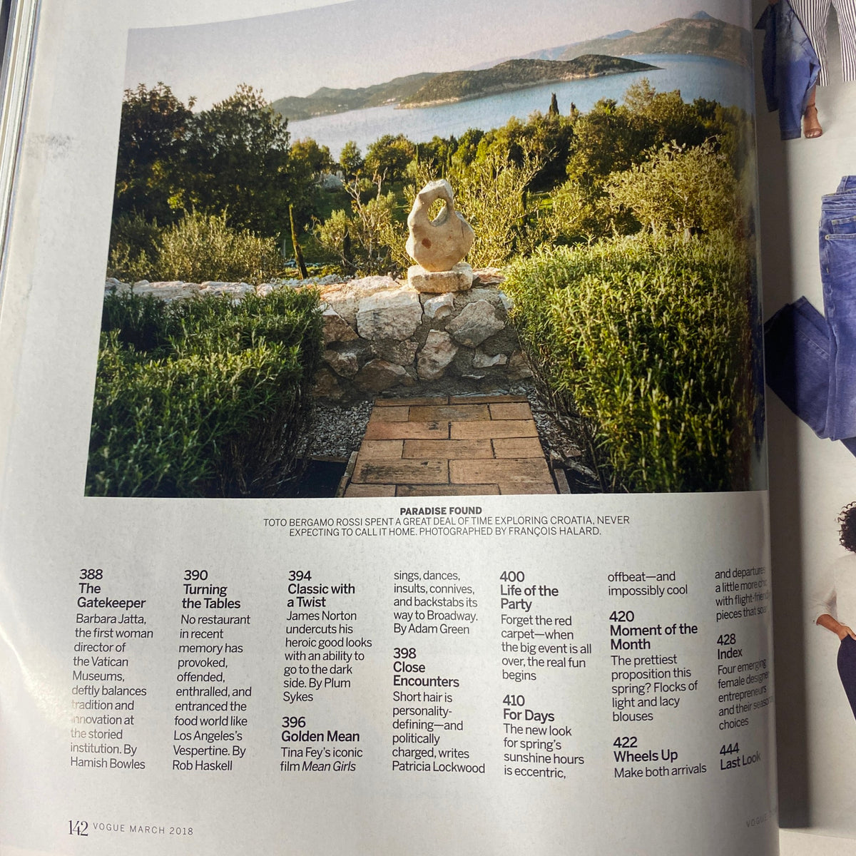 Vogue Magazine March 2018 Alicia Vikander Cover No Label VG features a scenic landscape with a stone statue, highlighting the theme 'Paradise Found,' as seen on page 142.