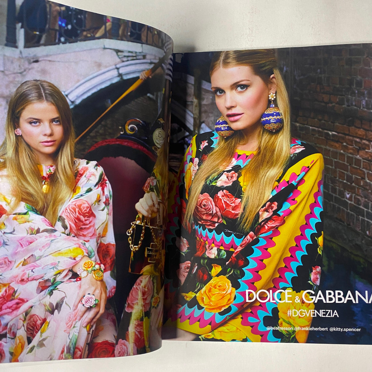 Vogue Magazine March 2018 Alicia Vikander Cover No Label VG displays a vibrant fashion ad by Dolce & Gabbana, featuring models in colorful floral dresses, emphasizing bold summer trends.