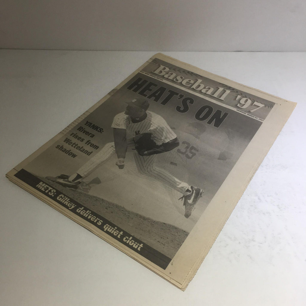 Baseball-themed newspaper cover from NY Daily News titled 'NY Daily News: March 27 1997 Heat's On Mets: Gilkey Delivers Quiet Clout' showcasing player in action on field.