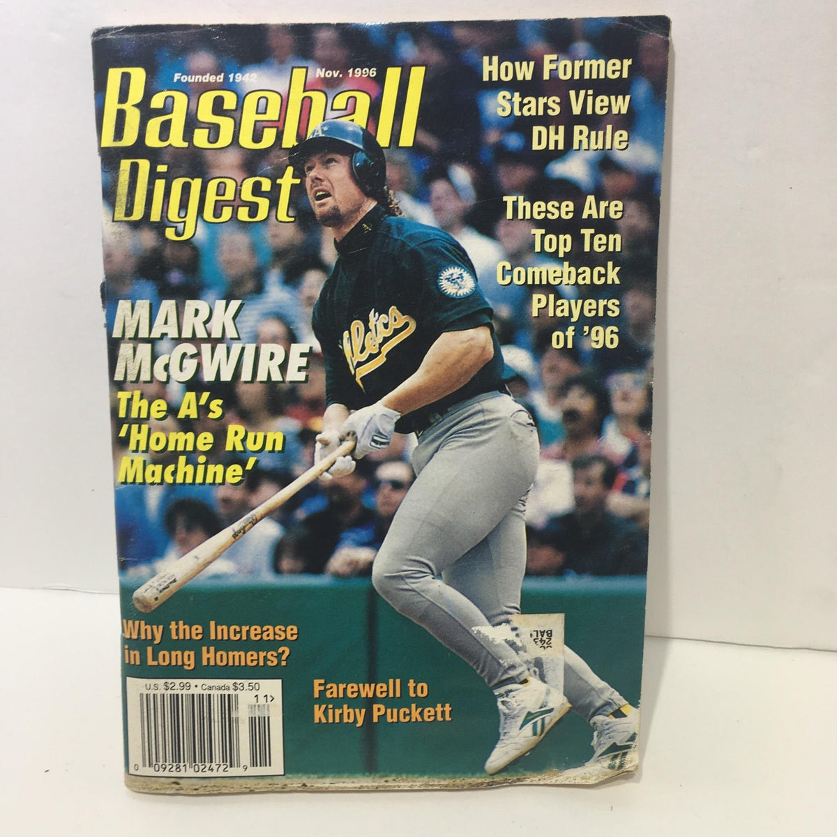 Cover of Baseball Digest Magazine from November 1996 featuring Mark McGwire, the A's 'Home Run Machine', including article headlines and details.