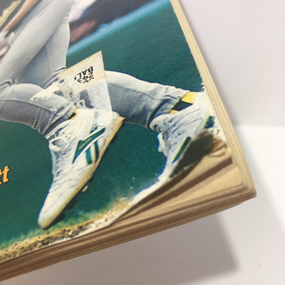 Close-up view of the bottom edge of the November 1996 Baseball Digest Magazine, illustrating the wear and the magazine's publication details.