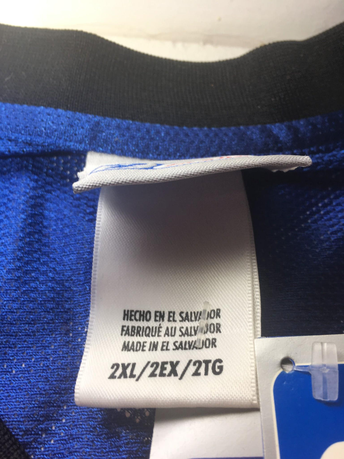 Inside label of the NBA New York Knicks Stephon Marbury #3 jersey size 2XL, indicating size and care instructions.