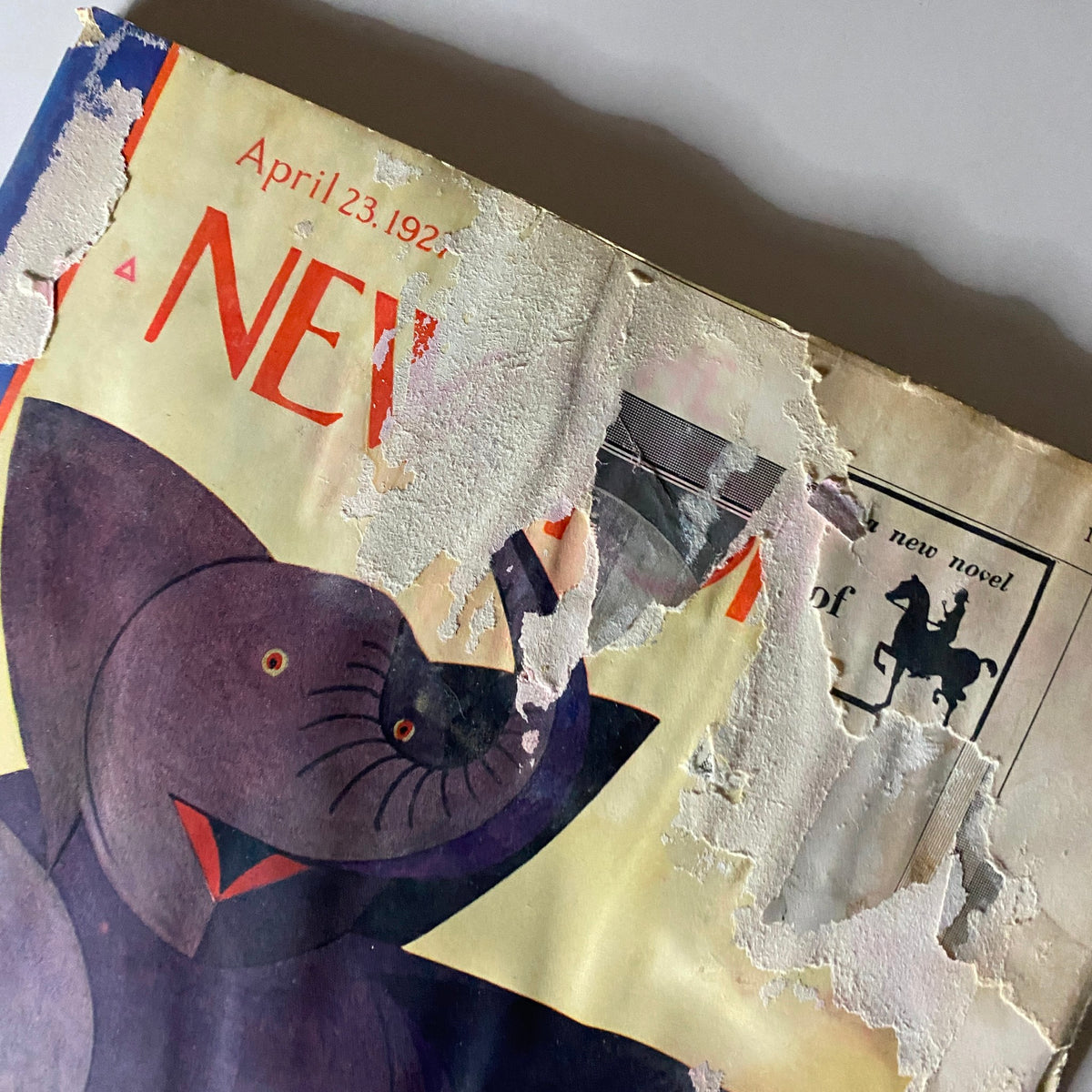 Damaged cover of The New Yorker Complete Magazine April 23, 1927, featuring a whimsical elephant illustration by André De Schaub.
