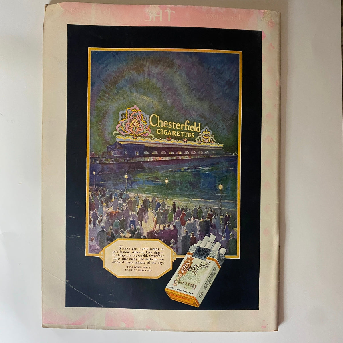 Vintage advertisement for Chesterfield Cigarettes featured in The New Yorker Complete Magazine January 15, 1927, showcasing an artistic illustration with a colorful lighted sign and crowds.