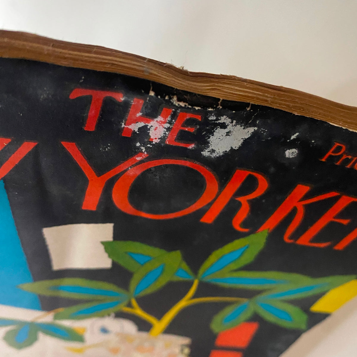 Close-up of the vintage cover of The New Yorker Complete Magazine October 1, 1927 by Gardner Rea, showing wear and tear highlighting its age.