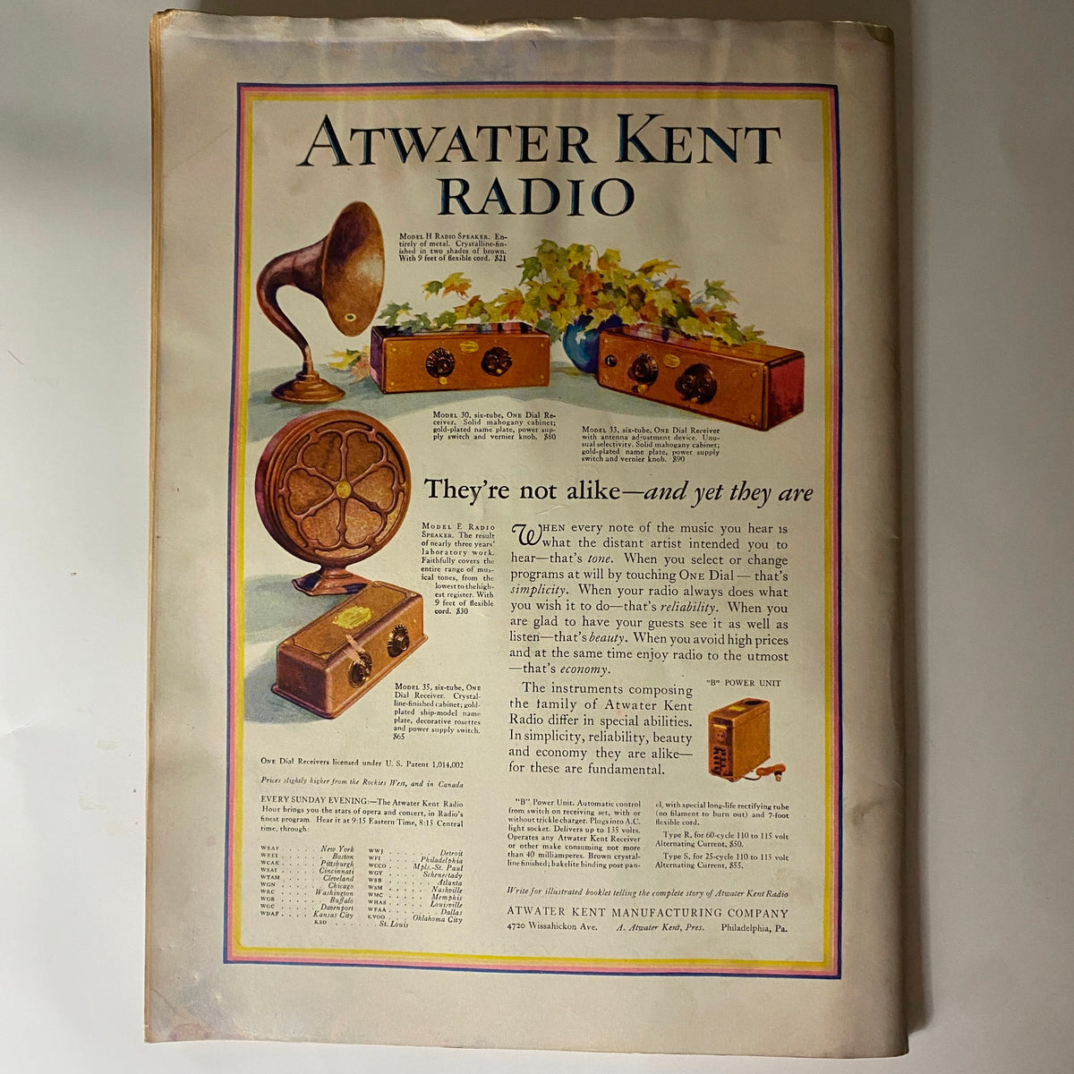 Atwater Kent Radio advertisement from The New Yorker magazine, October 1, 1927, showcasing vintage radios and an artistic illustration.