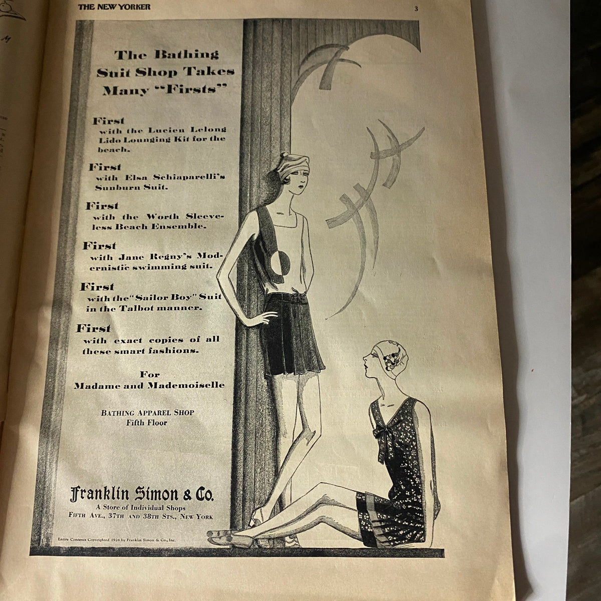 Vintage ad from The New Yorker Complete Magazine July 7, 1928 showcasing the Bathing Suit Shop with illustrations of fashionable swimsuits, highlighting 'firsts' in swimwear for women.