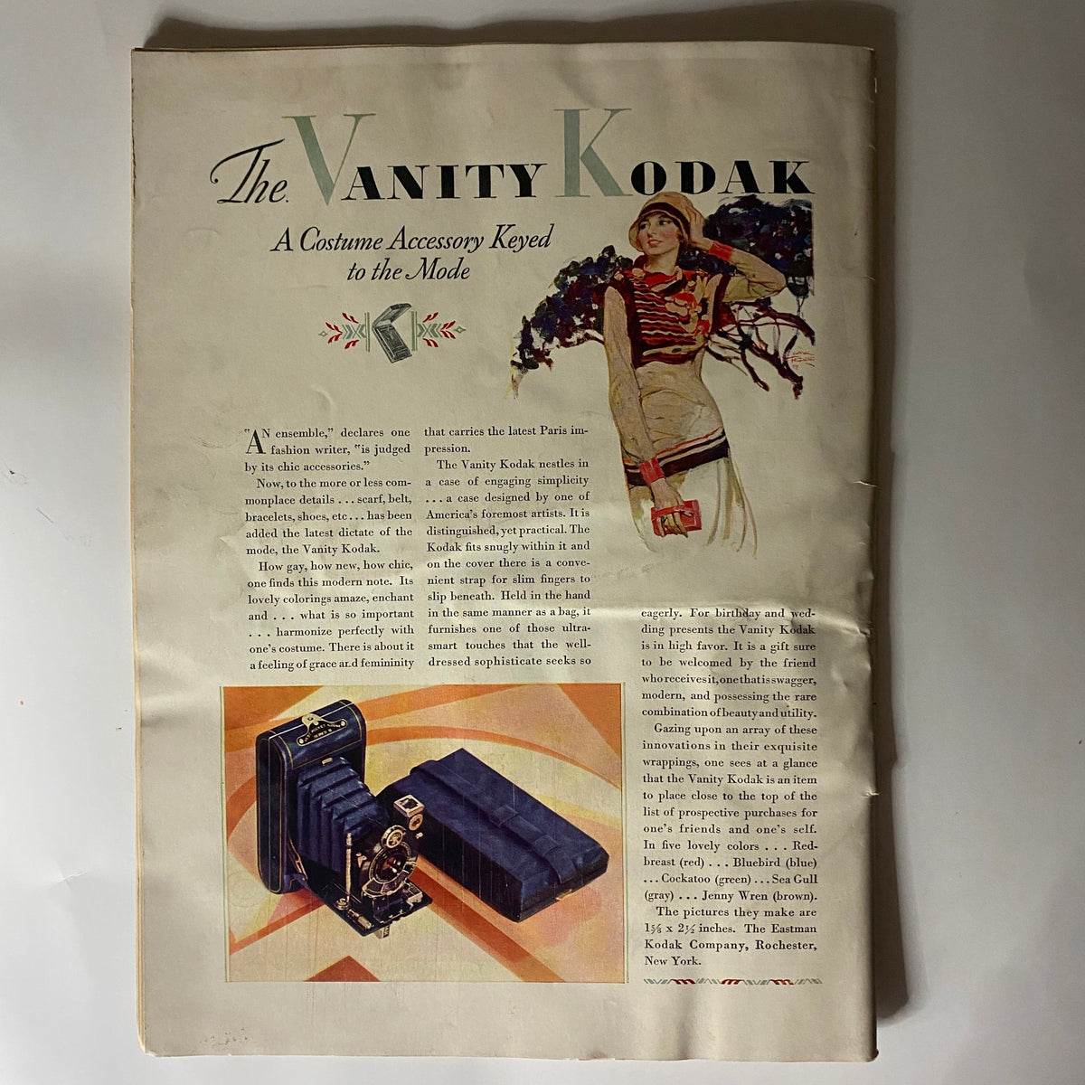 Vintage advertisement for the Vanity Kodak featured in The New Yorker Complete Magazine July 7, 1928, presenting a stylish camera along with fashion accessories, emphasizing the blend of photography and style.