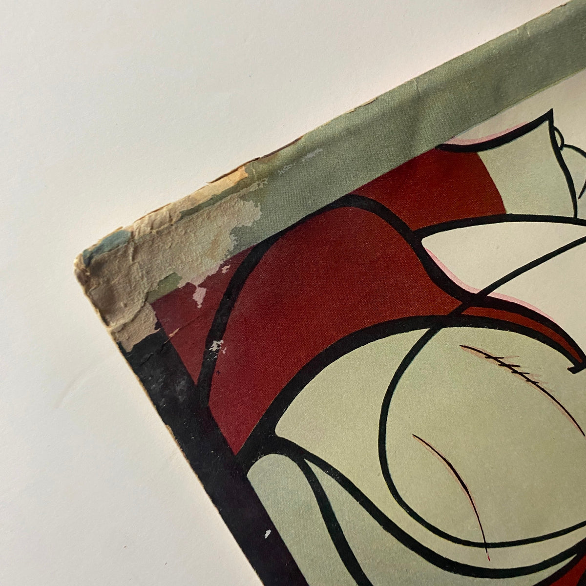 Close-up view of the damaged edge of The New Yorker Complete Magazine February 25, 1928, showing wear and tear on the cover.