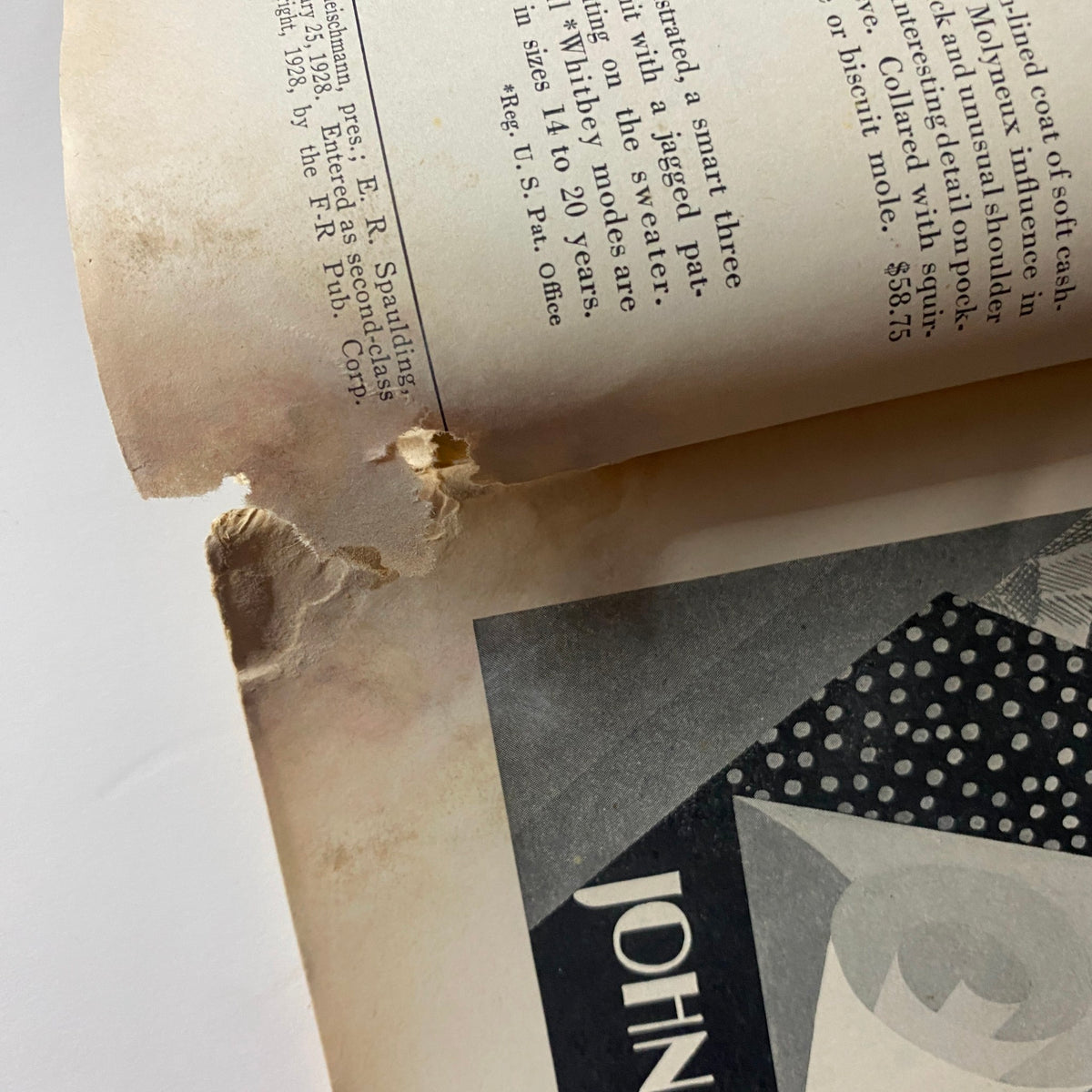 Detail of the vintage The New Yorker Complete Magazine February 25, 1928 showing wear and tear on the page edges.