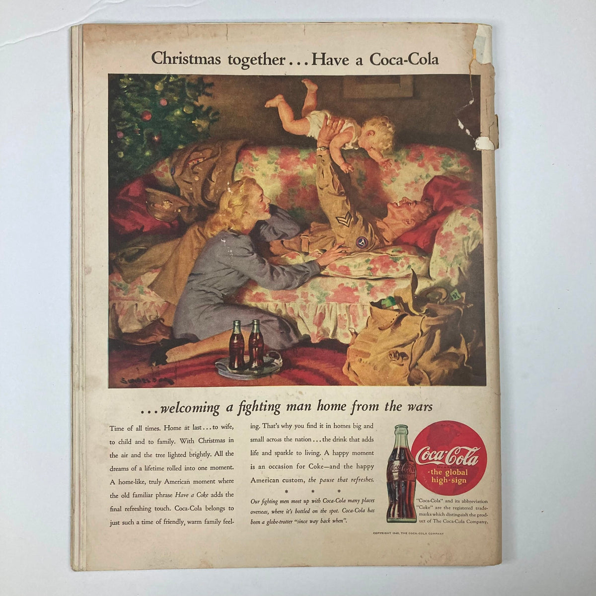 Back cover of VTG Collier's Magazine December 1 1945 displaying a nostalgic Coca-Cola advertisement portraying a warm family reunion atmosphere during Christmas.