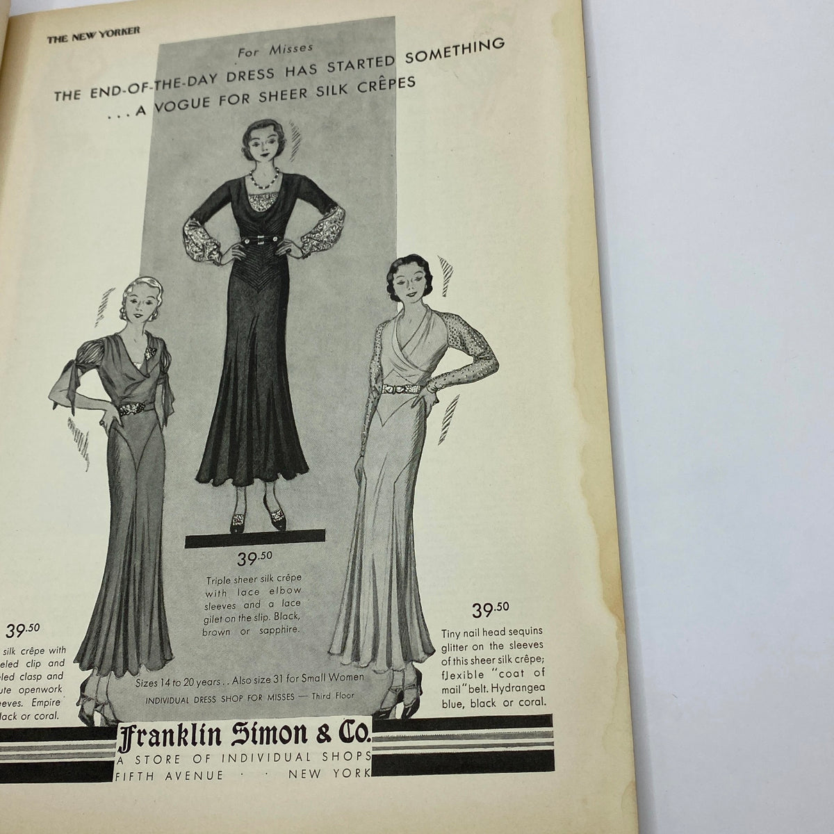Advertisement from The New Yorker Complete Magazine November 14, 1931, showcasing elegant dresses with sheer silk crêpe details.