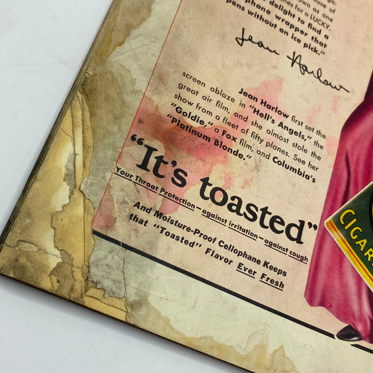 Close-up of an advertisement featuring Jean Harlow for Lucky Strike cigarettes, highlighting the slogan 'It's toasted' with details on cigarette quality, from The New Yorker Complete Magazine October 24, 1931