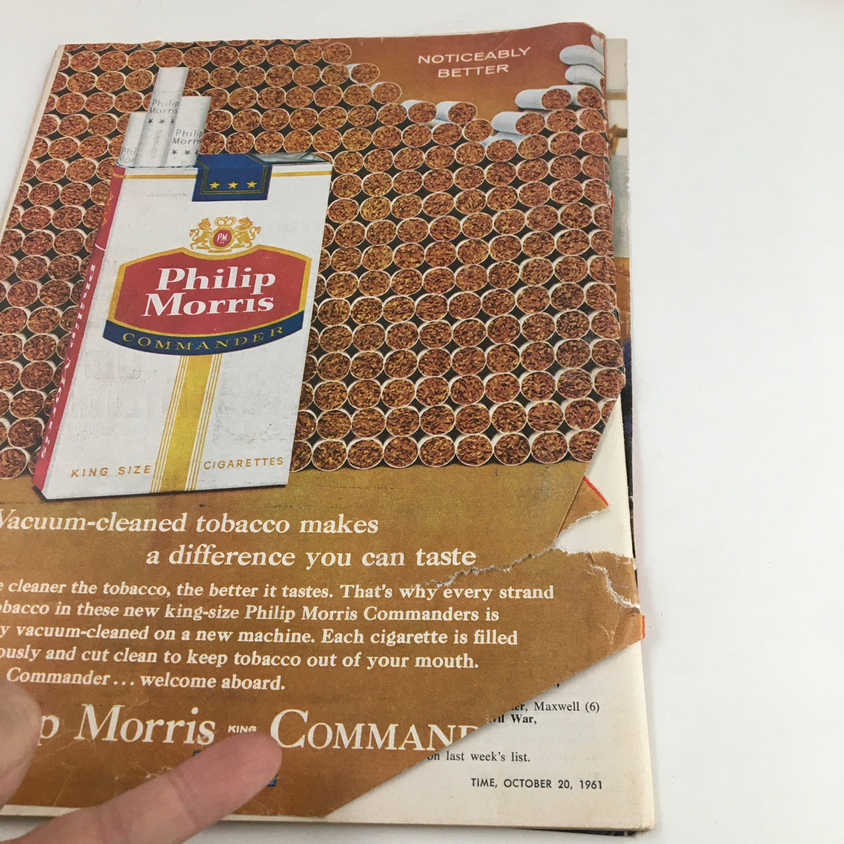 Back cover advertisement for Philip Morris cigarettes from Time Magazine October 20 1961, highlighting vacuum-cleaned tobacco for a better taste.