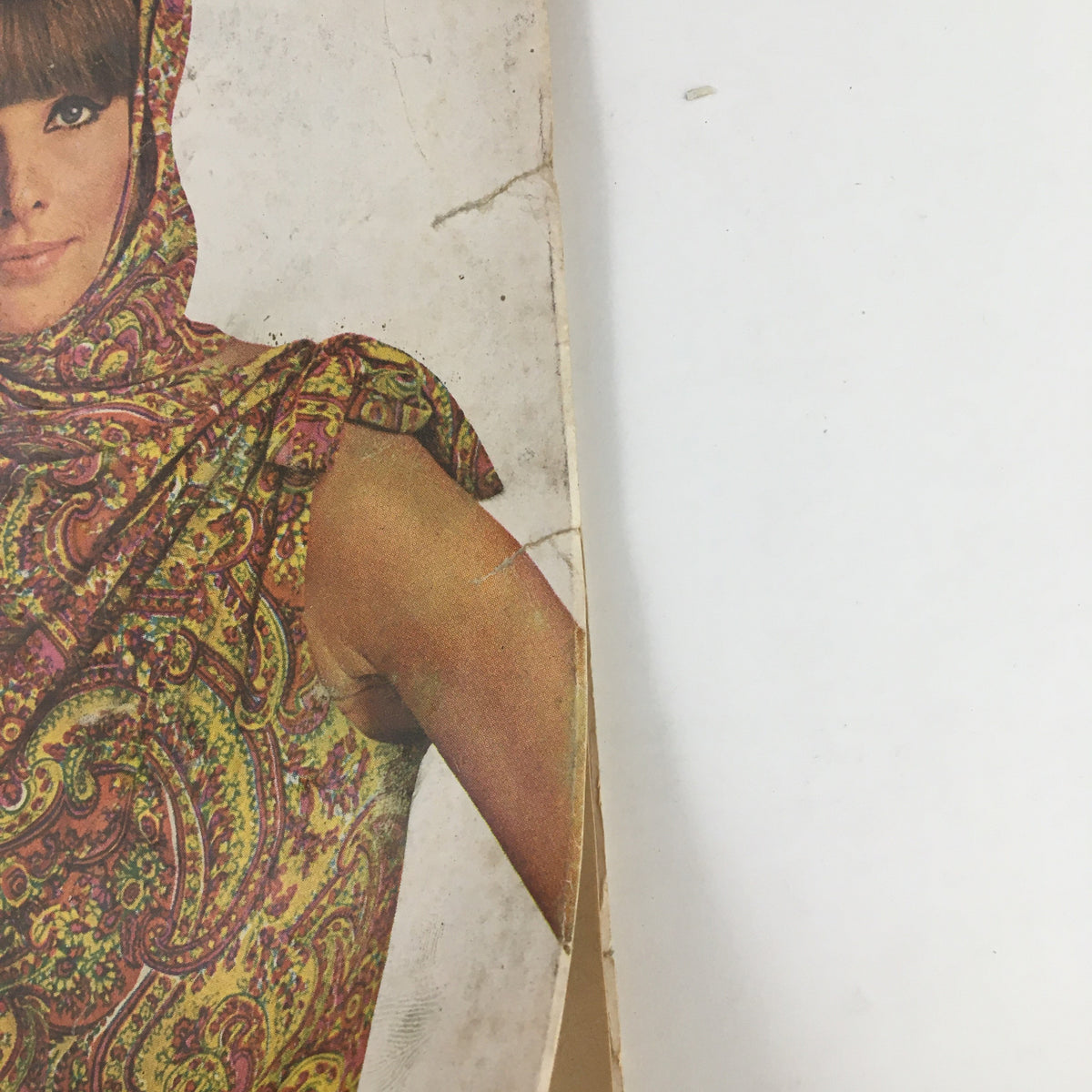 Close-up of the Lady's Circle Magazine August 1966 cover, highlighting the woman in a vibrant paisley scarf and outfit, with headlines on La Maze Method and parenting tips.