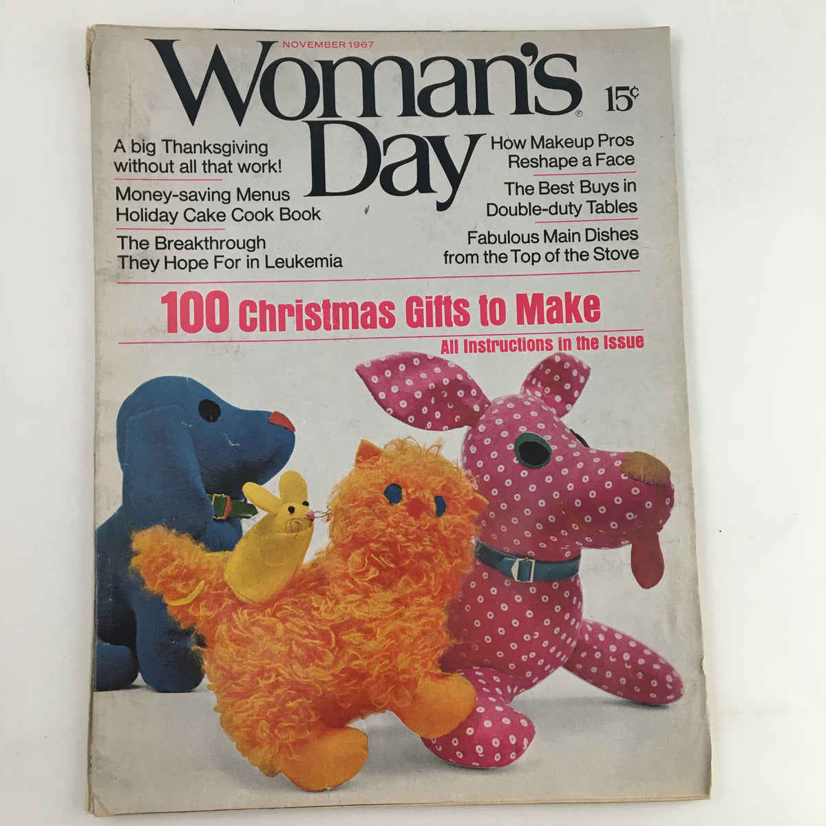 Cover of Woman's Day Magazine November 1967 featuring colorful plush toys and headlines on Christmas gifts and leukemia breakthroughs. Vintage collectible item.