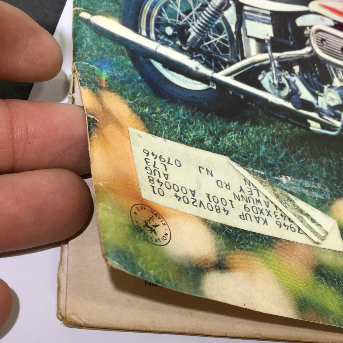 Close-up of the November 1970 Cycle Magazine cover with details of Harley-Davidson's Outrageous Super Glide, highlighting address label and wear indicative of vintage magazines.