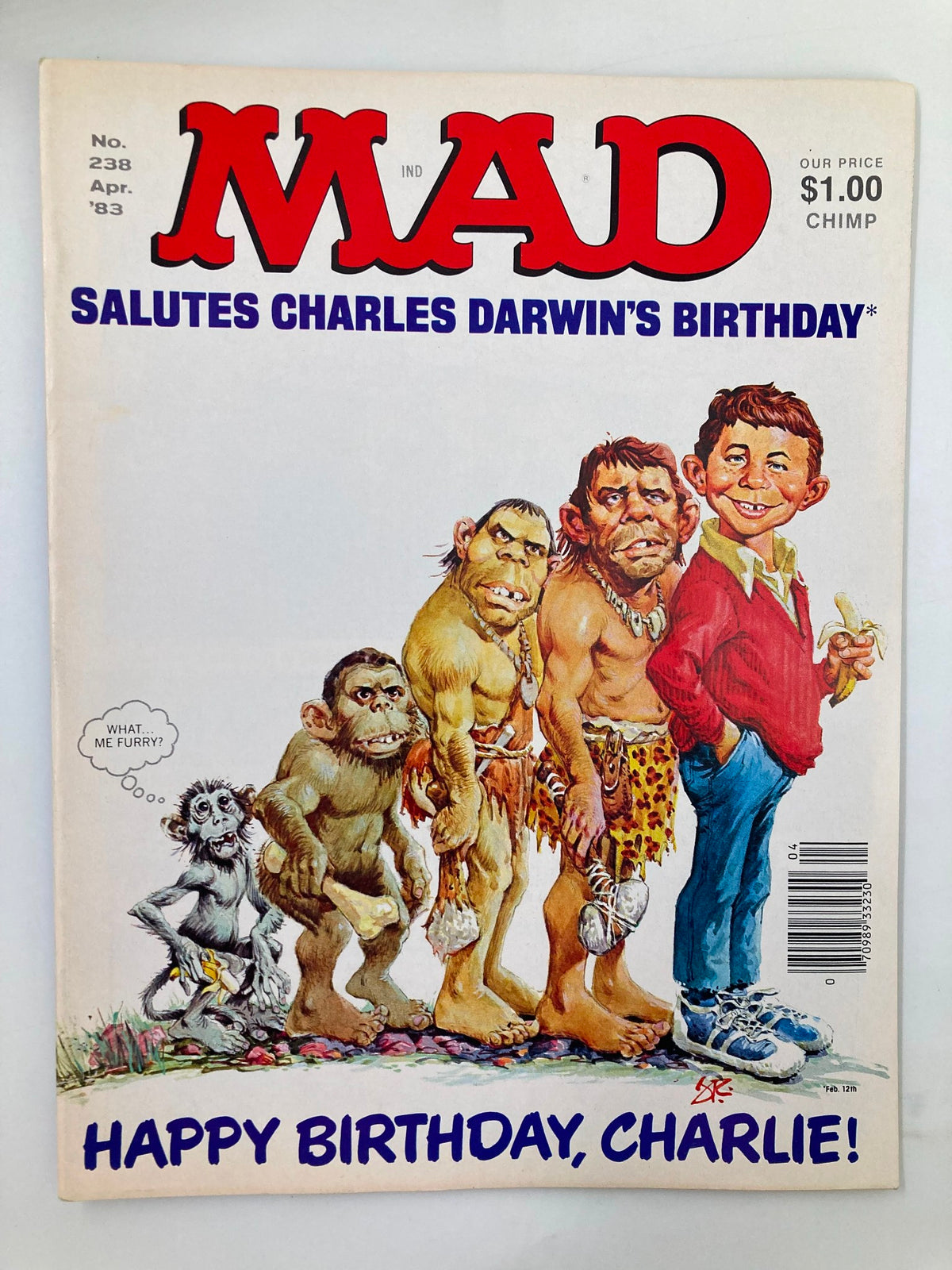Cover of Mad Magazine April 1983 No. 238 titled Happy Birthday Charlie featuring humorous illustrations celebrating Charles Darwin's birthday with Charlie Brown and other characters.